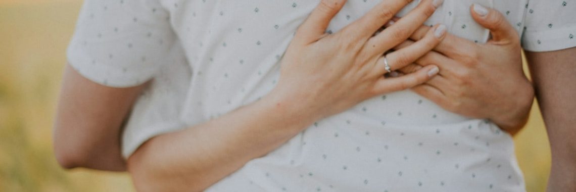 a person holding the hands together